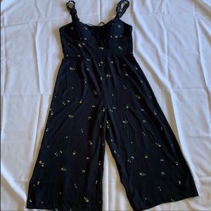 Black floral jumpsuit with ruffled straps